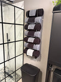 Hand-crafted using cypress to resist humid environments. this towel organizer mounts to the wall and holds up to seven rolled towels.  And because of the varying grain patterns in the cypress, each towel organizer is unique and truly one of a kind adding a touch of class to your bathroom.
