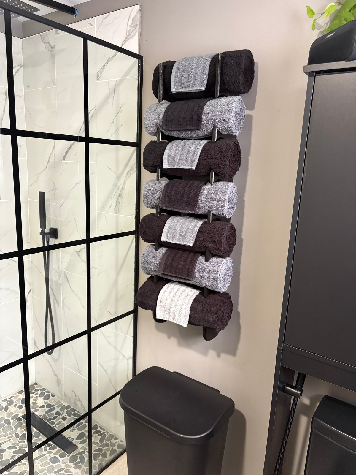 Hand-crafted using cypress to resist humid environments. this towel organizer mounts to the wall and holds up to seven rolled towels.  And because of the varying grain patterns in the cypress, each towel organizer is unique and truly one of a kind adding a touch of class to your bathroom.